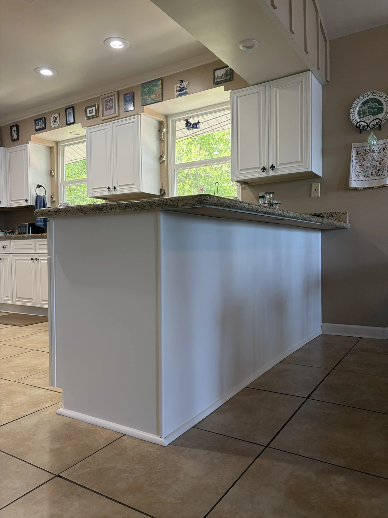 Kitchen cabinets before being painted with SW Greek Villa in Hide-A-Way Lake, MS - Paint Star