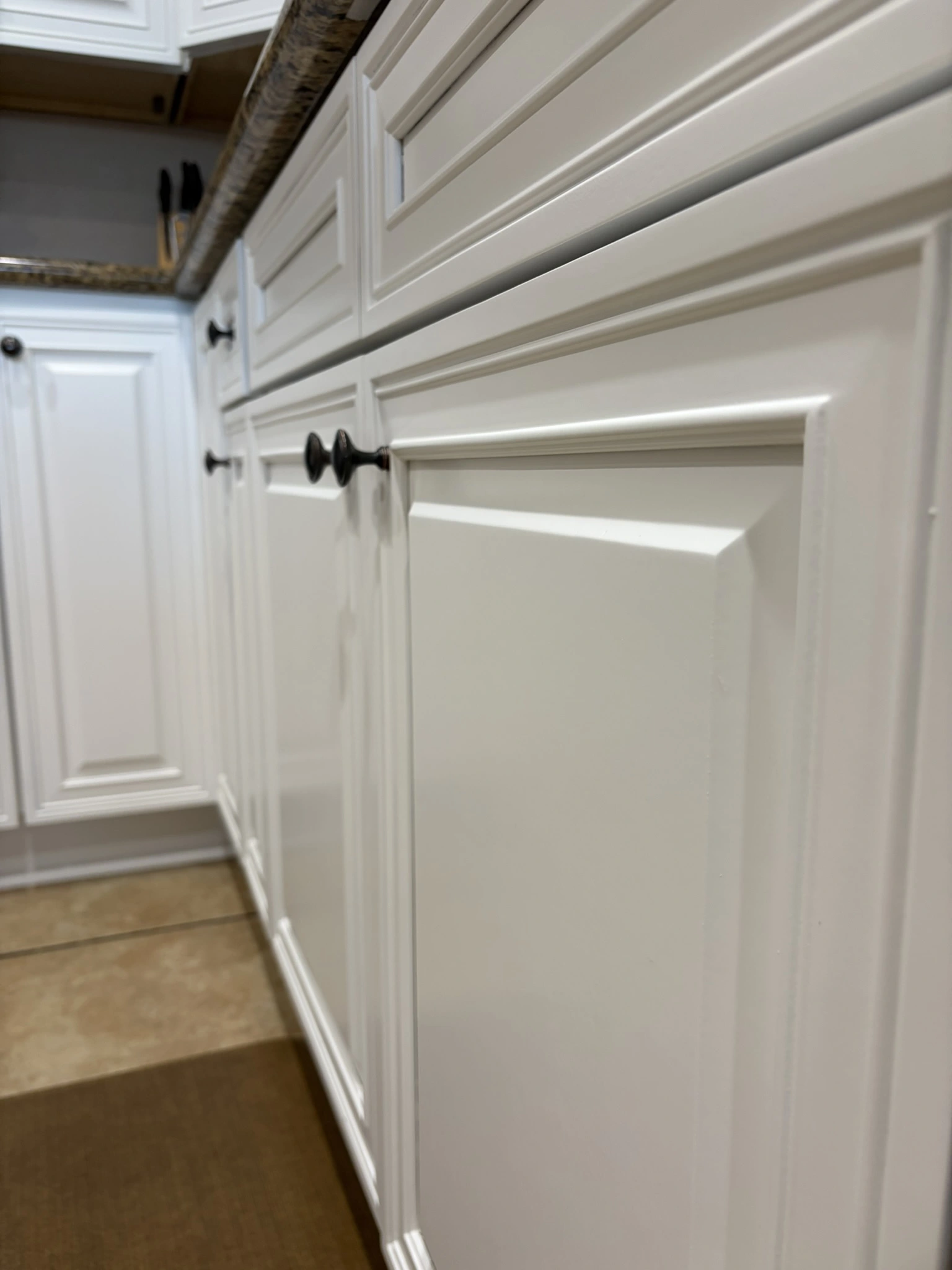 Kitchen cabinets before being painted with SW Greek Villa in Hide-A-Way Lake, MS - Paint Star