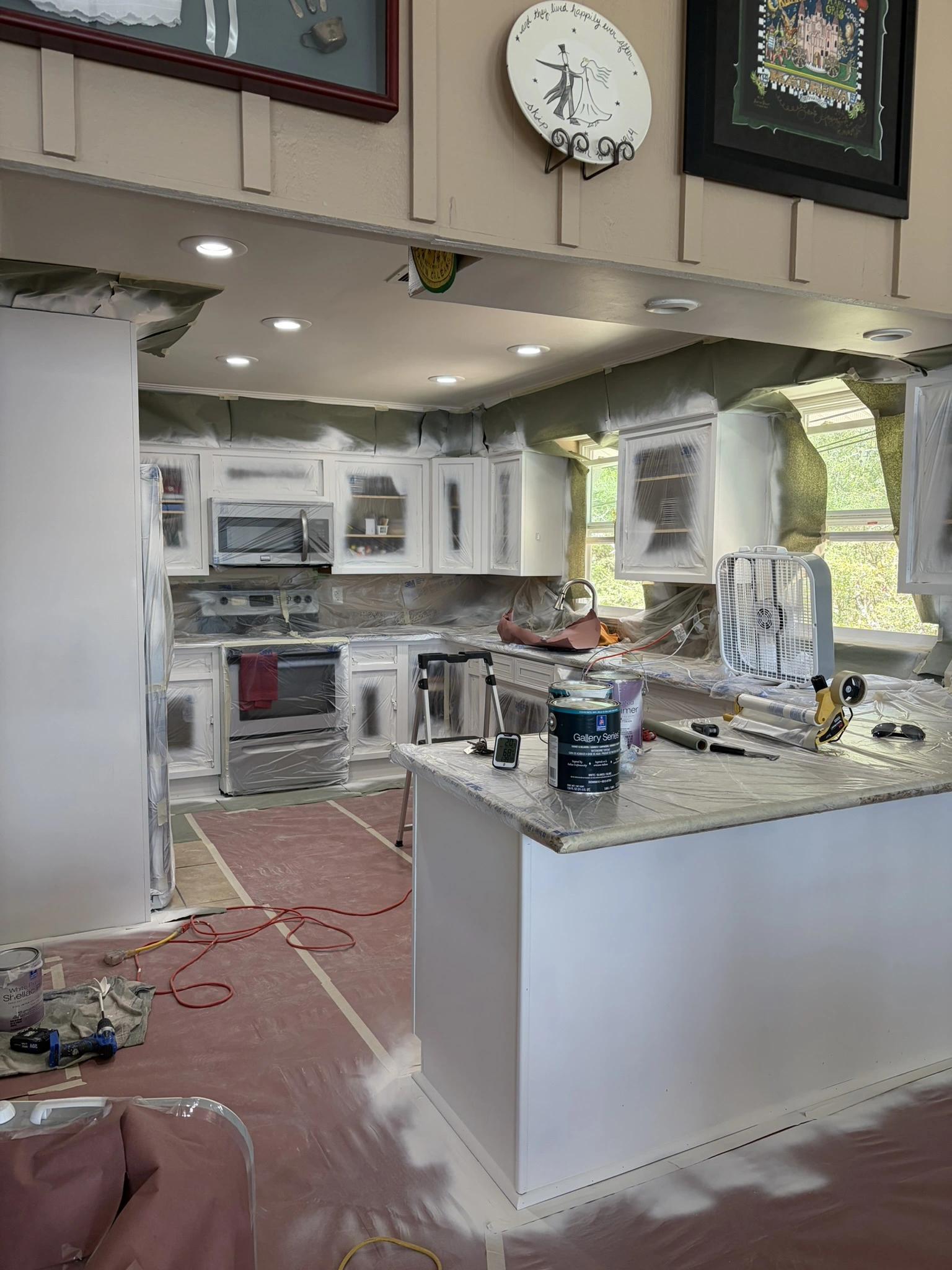 Kitchen cabinets being painted with SW Greek Villa in Hide-A-Way Lake, MS - Paint Star